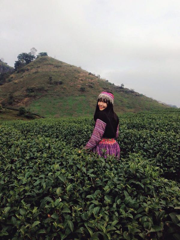 An ethnic minority girl in the middle of the tea plantation in Moc Chau