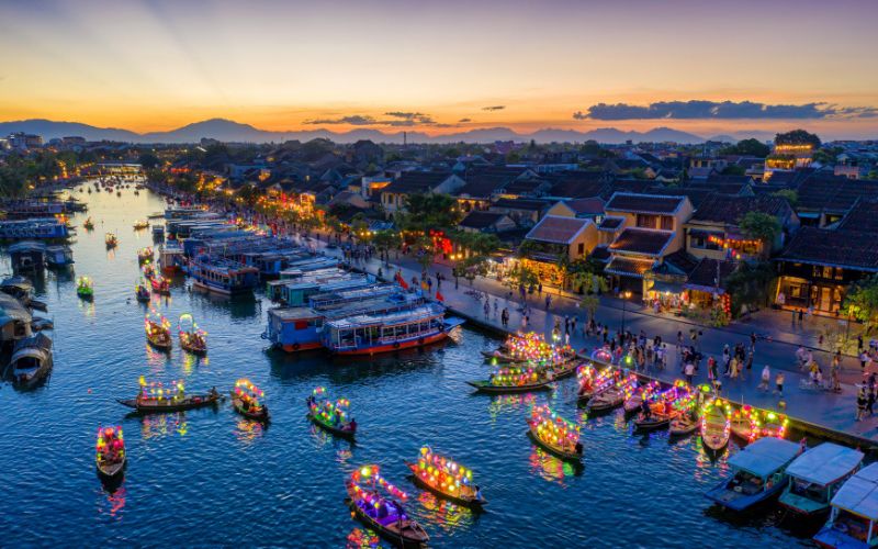 As the sun sets, the lantern lights in Hoi An