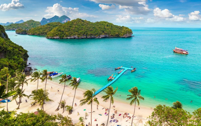 Scenic view of Ang Thong Marine National Park with turquoise water, islands, palm trees, and a tropical beach