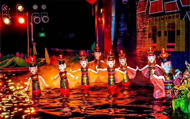 Colorful wooden puppets come to life on water as traditional Vietnamese music fills the air during a performance at Hanoi’s famous Thang Long Water Puppet Theatre.