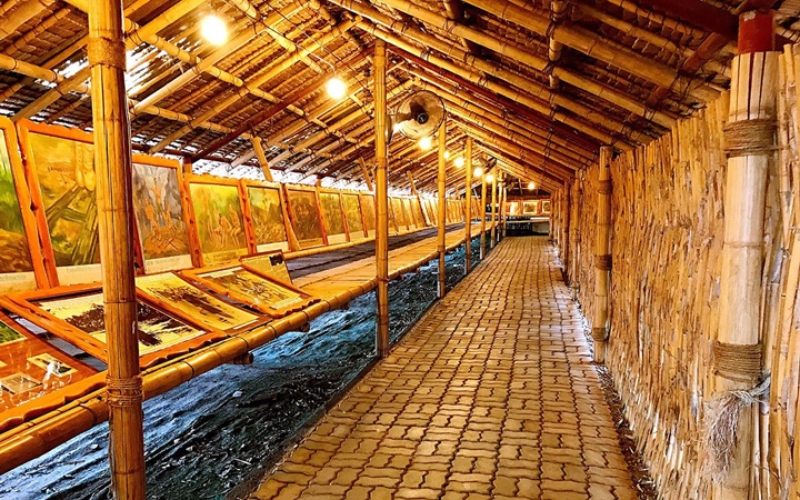 Replica bamboo huts inside JEATH War Museum, showing the harsh living conditions of prisoners of war during the construction of the Death Railway.