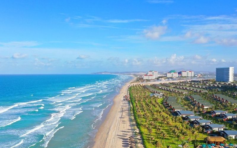 Aerial view of Bai Dai Beach in Cam Ranh with long sandy shore, blue sea, and beachfront resorts