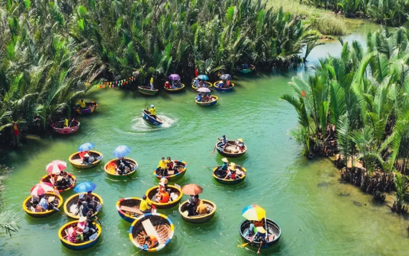 A peaceful basket boat ride through the lush waterways of Bay Mau Coconut Forest, where visitors can enjoy traditional folk performances and hands-on paddling in the heart of Hoi An’s countryside.