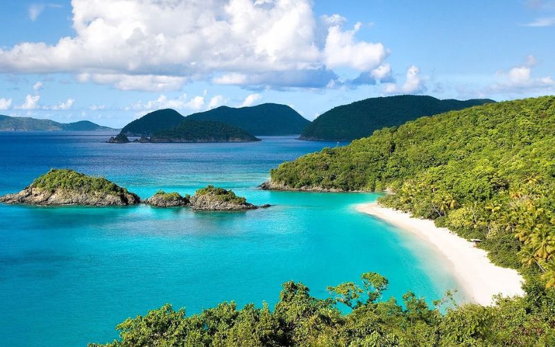 Stunning view of Cam Ranh Bay with turquoise water, white sand beach, and green hills in Khanh Hoa, Vietnam