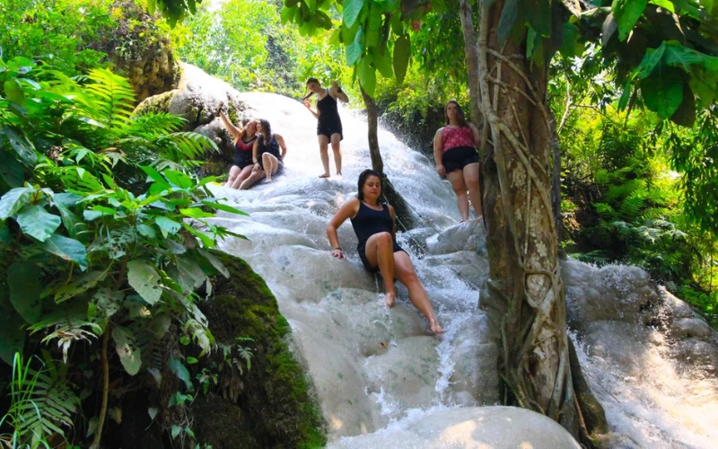 Close-up of the unique limestone surface that makes the waterfall “sticky” and safe to walk on