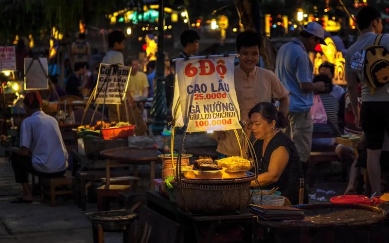 Cong Nu Ngoc Hoa Night Market in Hoi An with local vendors selling street food and handmade goods in a lively evening setting