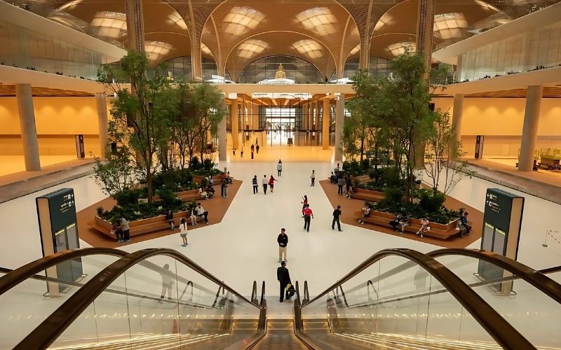 Interior design of Techo International Airport (KTI) in Cambodia, featuring modern architecture, greenery, and spacious halls.