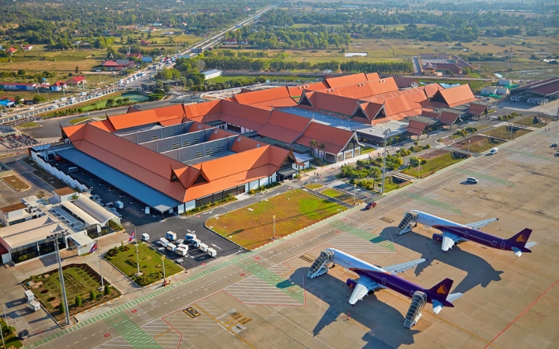 Siem Reap International Airport terminal with travelers arriving, a gateway for visitors heading to Angkor Wat.