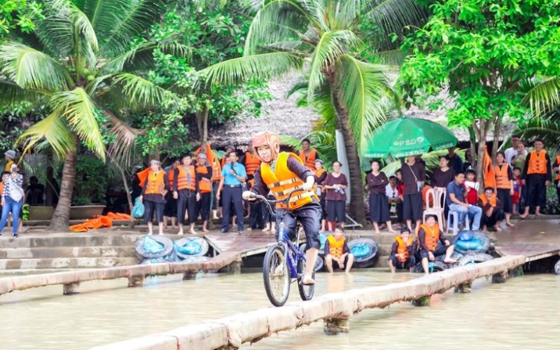 Experience the joy of Vietnamese folk games with locals in a lively setting