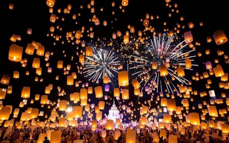 Traditional floating lanterns lighting up the sky during the Loy Krathong celebration