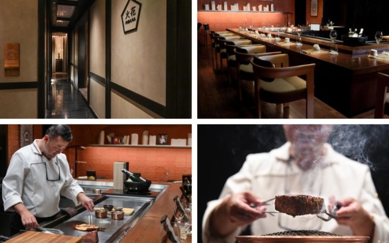 A master chef at Hibana by Koki meticulously prepares teppanyaki dishes at an intimate 14-seat counter, surrounded by warm wood interiors and ambient lighting.