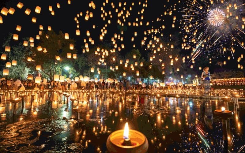 Thousands of floating lanterns and candles light up the night sky during the Loy Krathong Festival in Thailand