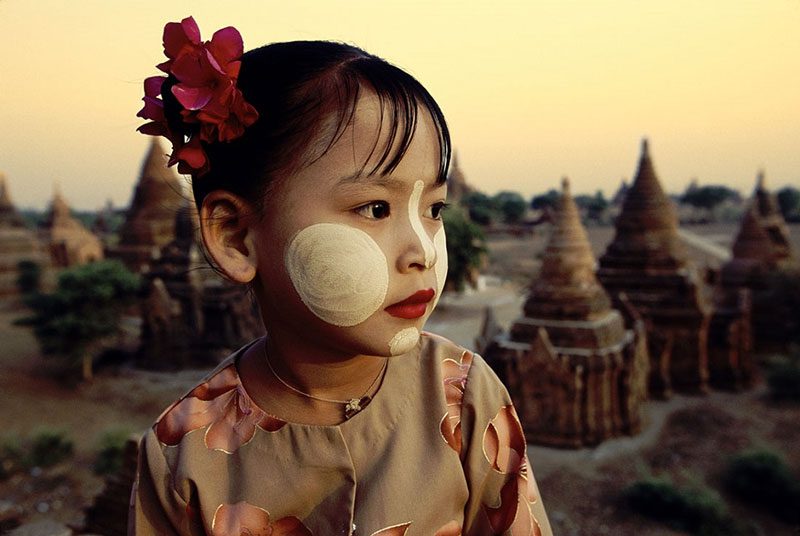 Myanmar girls use Thanaka as make-up powder on their face, neck and hands to protect themselves from the sun