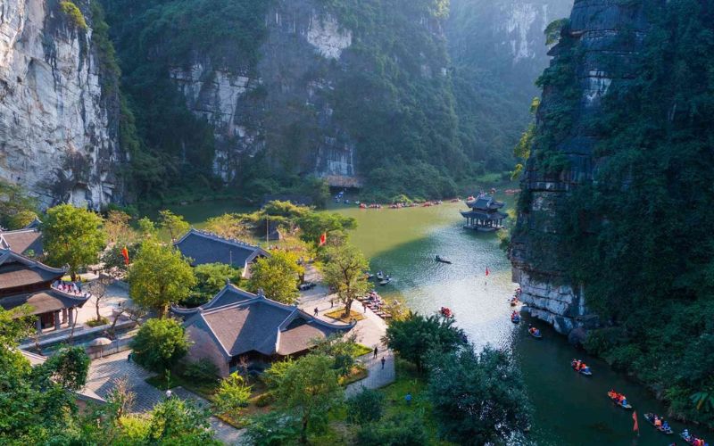 Peaceful river winding through limestone mountains in Ninh Binh
