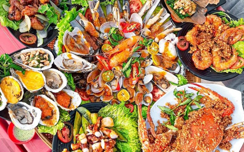 Delicious seafood feast with crab, shrimp, clams, and shellfish specialties in Nha Trang, Vietnam
