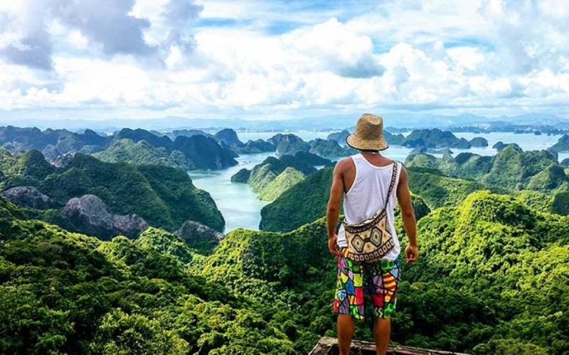 A breathtaking view from the top of Ngu Lam Peak, the highest point in Cat Ba National Park. After a rewarding jungle hike, travelers are greeted with panoramic views of limestone mountains and lush tropical forest stretching as far as the eye can see.