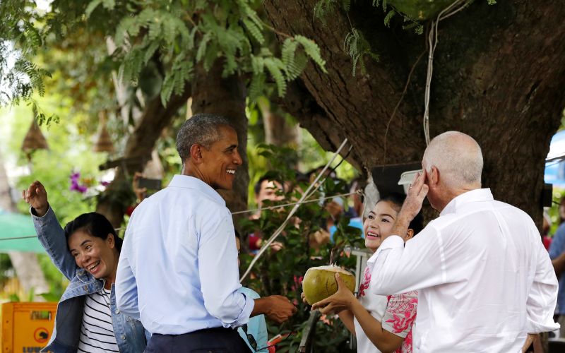 Obama drinking coconut in Luang Prabang