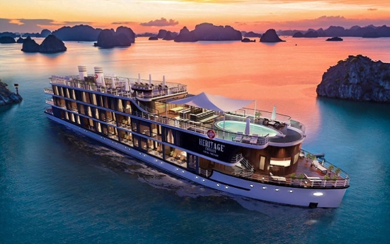 A peaceful sunset cruise in Halong Bay, surrounded by emerald waters and dramatic limestone cliffs - the perfect setting for romance and unforgettable memories in Vietnam.