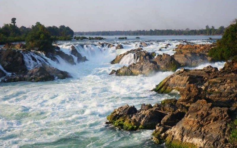 Waterfalls flowing over rocky terrain at Si Phan Don (Four Thousand Islands) in southern Laos.