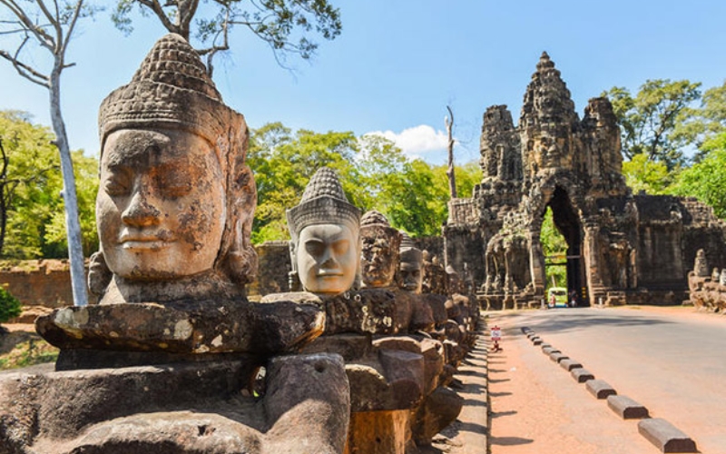 Close-up of a serene stone face carved into the towers of Bayon Temple in Angkor Thom, Cambodia.