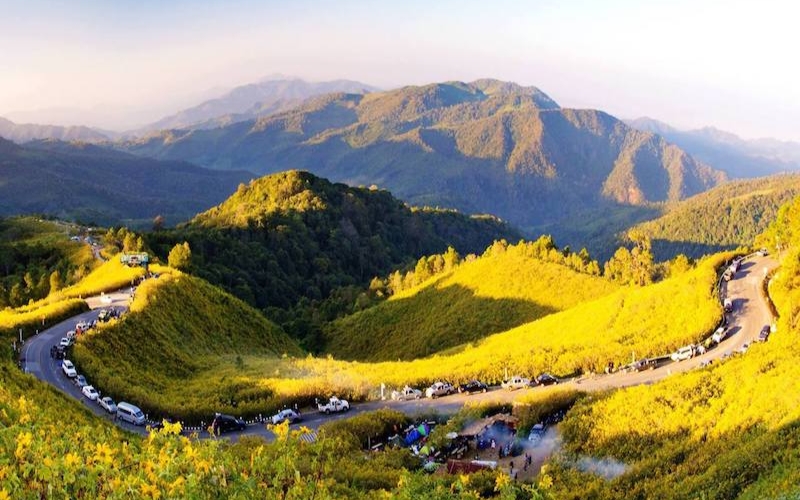 A panoramic view of hills and forests from a roadside lookout on the Mae Hong Son Loop