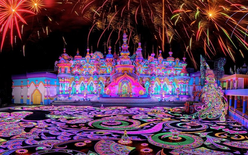 Colorful fireworks and illuminated decorations lighting up the night sky at Carnival Magic, creating a festive and magical atmosphere.