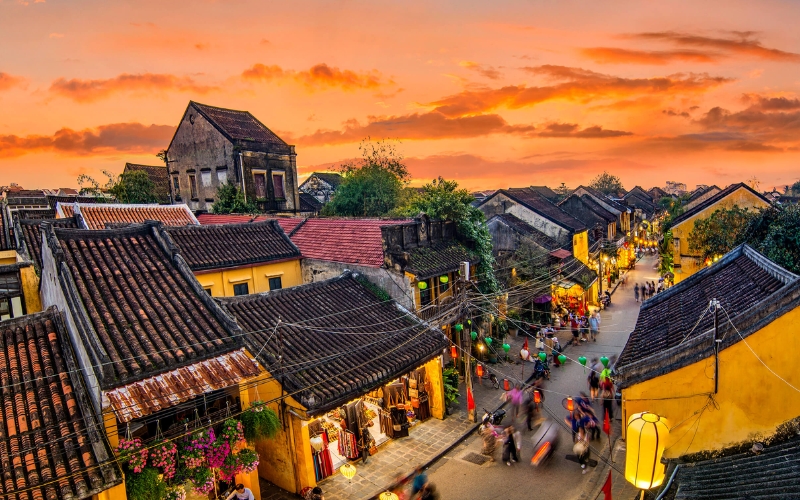 As the sun sets, Hoi An’s ancient streets come alive with colorful lanterns, creating a dreamlike atmosphere that feels frozen in time.