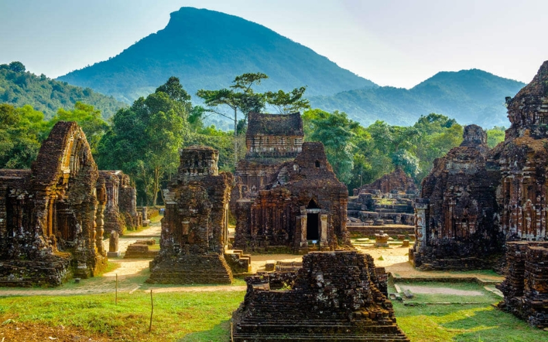 The red-brick towers of My Son Sanctuary stand quietly among the lush green hills, offering a glimpse into the spiritual heart of the ancient Champa Kingdom, just an hour from Hoi An.