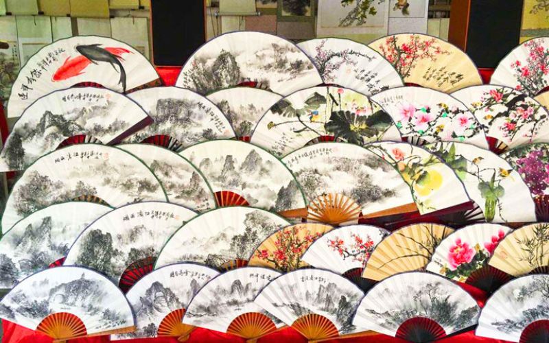 Traditionally painted fans in Fuli Town