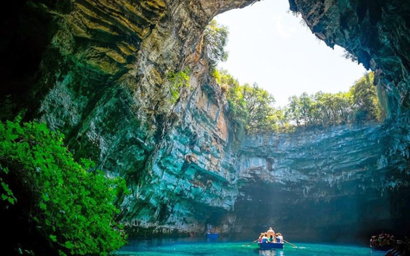 Boat entering the magnificent Phong Nha Cave in Phong Nha–Ke Bang National Park, Vietnam, a UNESCO World Heritage site