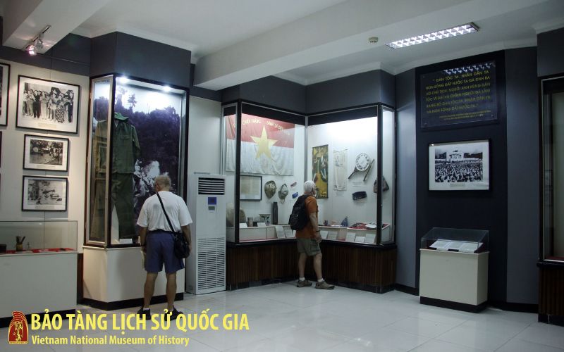 The exterior of a grand, yellow Indochina-style building that serves as the museum's wing dedicated to the Vietnamese Revolution.