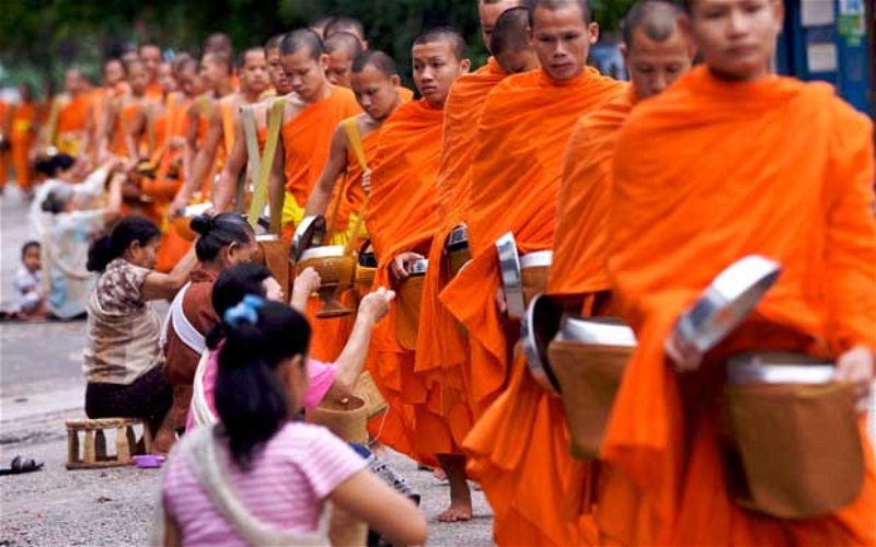 Visitors can experience the almsgiving ceremony at the first day of Bun Bang Fai